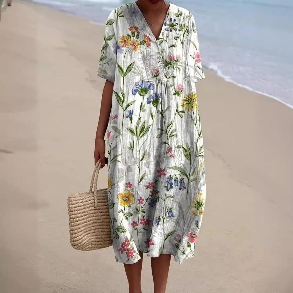 Locker fallendes Damen Freizeitkleid Talia mit Blumenmuster & V-Ausschnitt, ideal für Sommer & Strand.