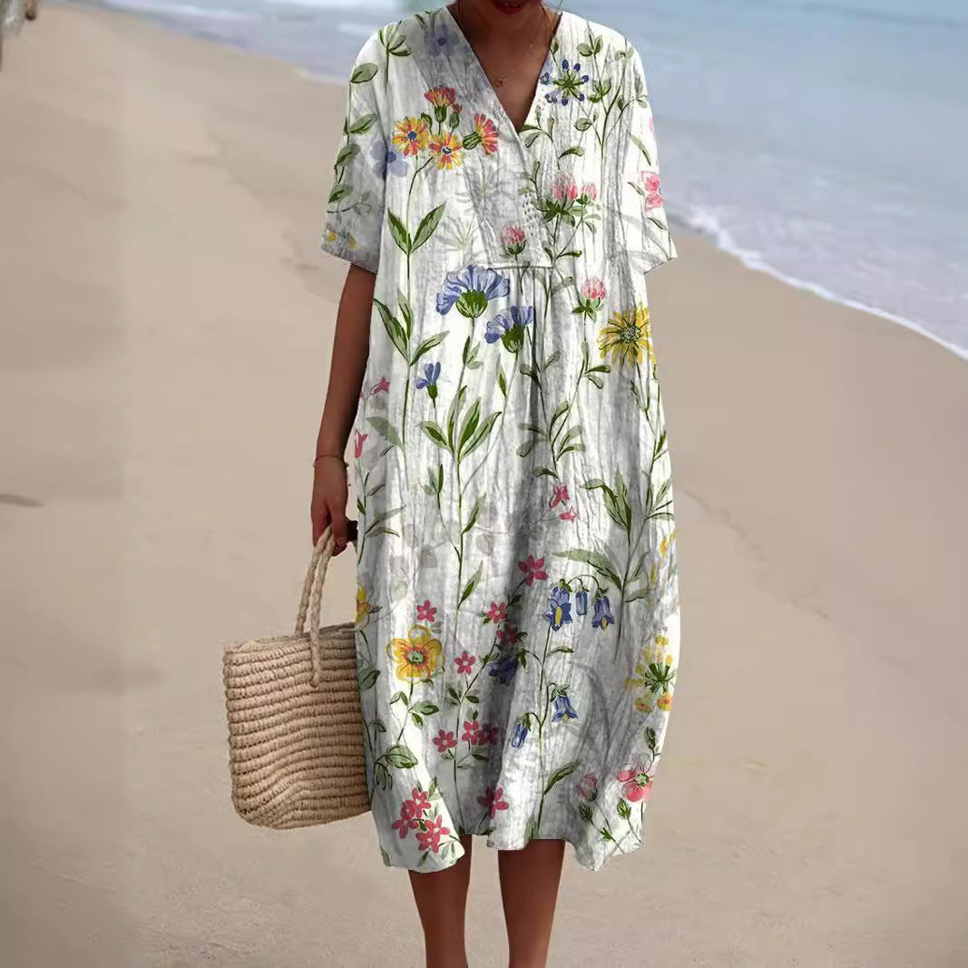 Locker fallendes Damen Freizeitkleid Talia mit Blumenmuster & V-Ausschnitt, ideal für Sommer & Strand.