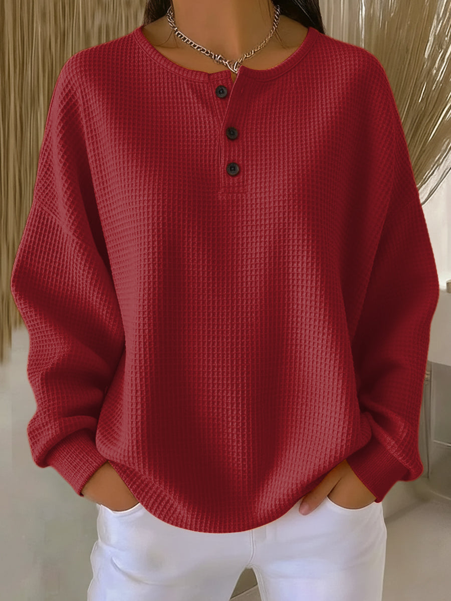 Vielseitiges Damen Pullover Oberteil mit Waffelstruktur und Henley-Ausschnitt, bequem für den Alltag.