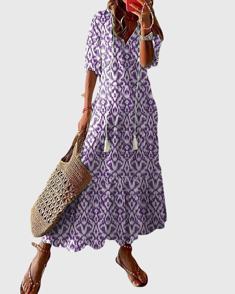 Damen A-Linien Sommerkleid mit V-Ausschnitt, im Boho Vintage Design. Leicht und ideal als Strandkleid.