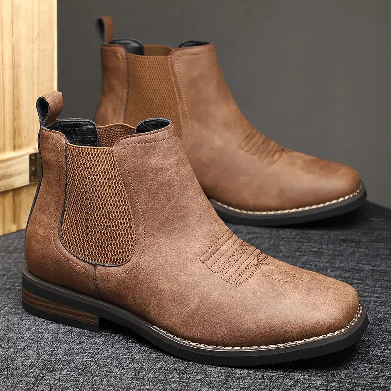 Elegante Herrenschuhe: dunkelbraune Chelsea Boots mit elastischen Einsätzen, zeitloser Stil für jede Garderobe.
