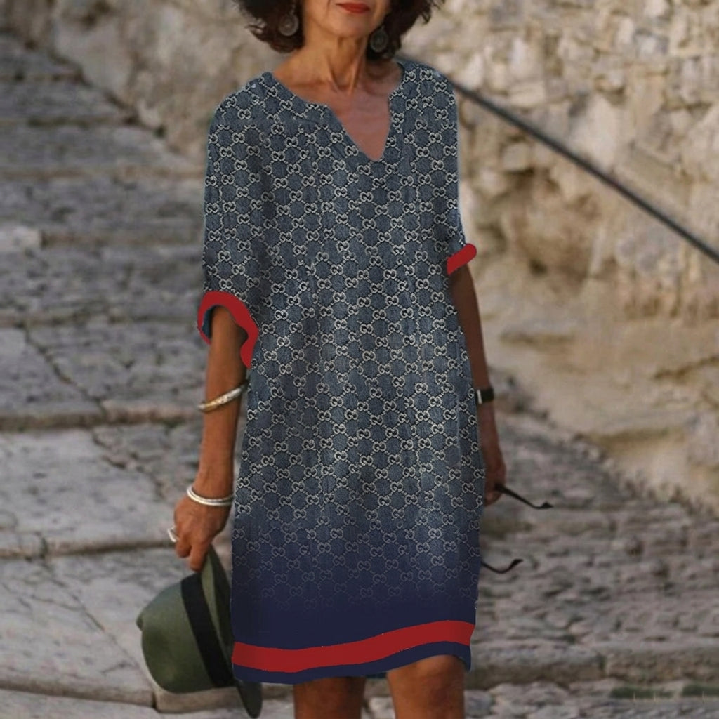 Modernes Damen Midi-Kleid mit Blumenmuster, eleganter V-Ausschnitt & bequeme 3/4-Ärmel.