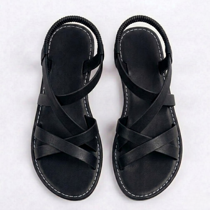 Bequeme flache Damensandalen mit überkreuzten Knöchelriemen, optimal für Strand und Freizeit im Sommer.