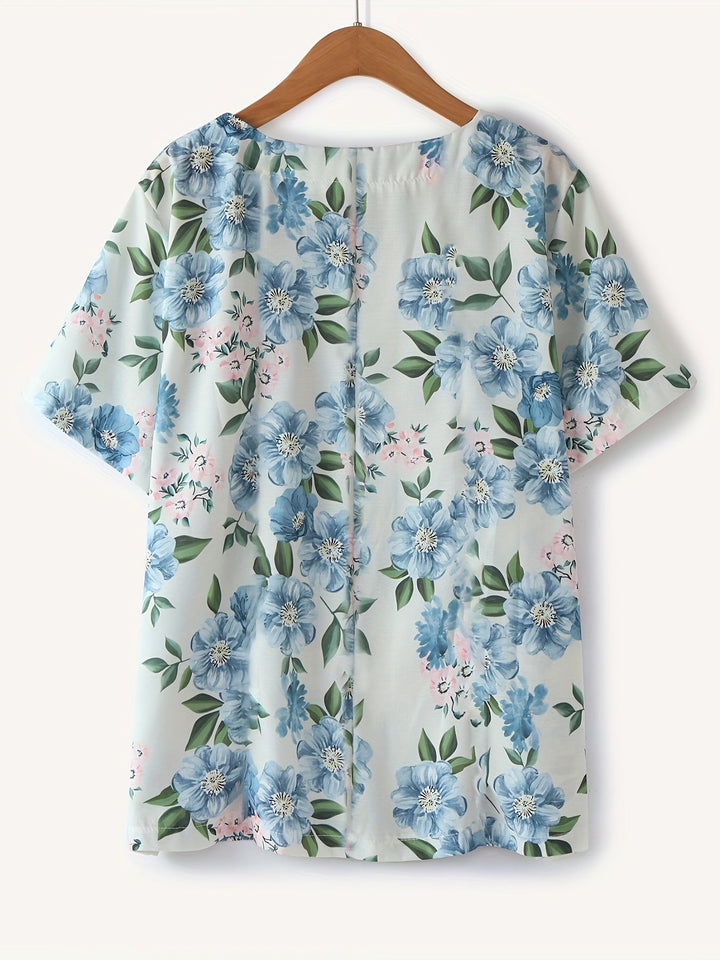 Modisches Vintage Damen Oberteil für den Sommer mit floralem Muster und praktischer Knopfleiste.