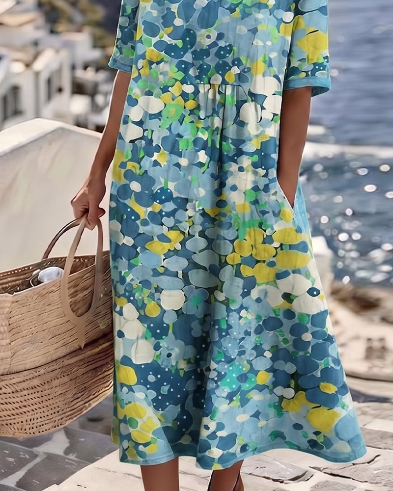 Schmeichelhaftes Sommerkleid in Midilänge, mit wunderschönem Blumenmuster & bequemem Schnitt.