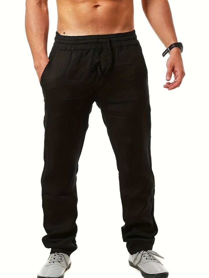 Weiße Loose-Fit Herren Sommerhose mit Kordelzug, leicht und atmungsaktiv für heiße Tage.