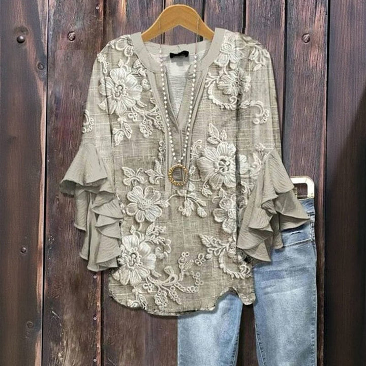 Trendige Damen Langarmbluse mit Blumenprint und schwingenden Rüschenärmeln. Perfekt für Frühling/Sommer.