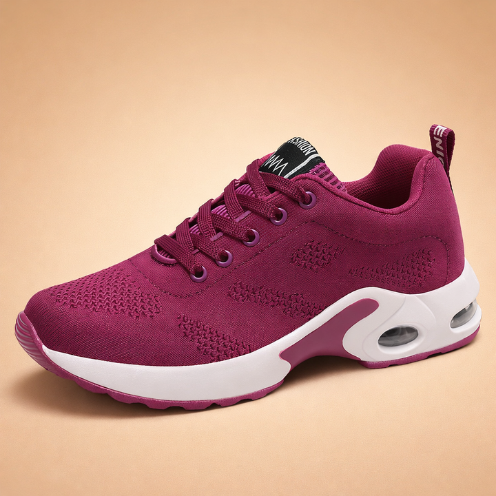 Moderner Damen-Sneaker in lebhaftem Lila, leicht und atmungsaktiv, perfekt für elegante Freizeitlooks.
