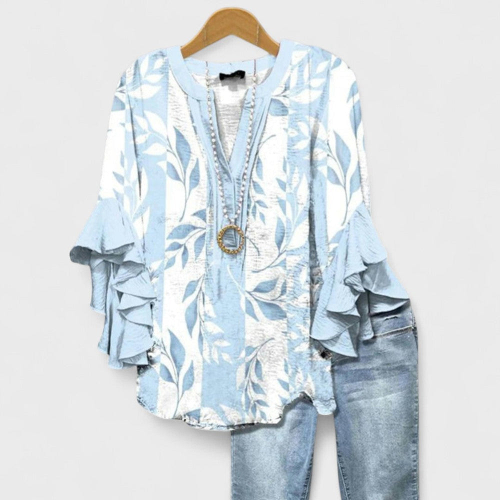 Florale Damenbluse mit V-Ausschnitt, Volantärmeln. Feminin & elegant für Freizeit oder Büro.