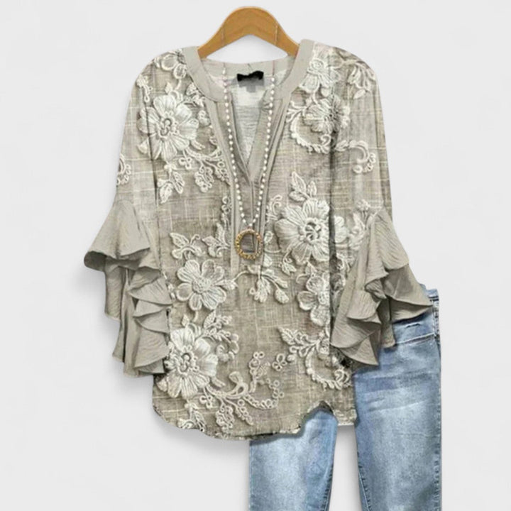 Damenbluse mit auffälligen Volantärmeln & femininem V-Ausschnitt. Elegantes Oberteil für Damen.