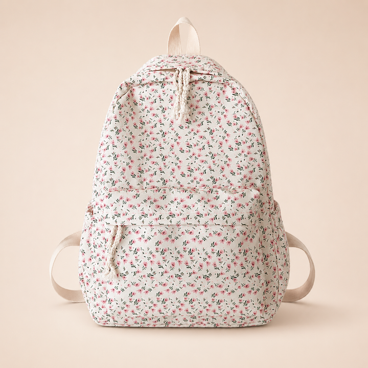 Nahaufnahme des weißen Damenrucksacks mit zartem rosa Blumenmuster. Perfekter, leichter Schulrucksack für Freizeit.