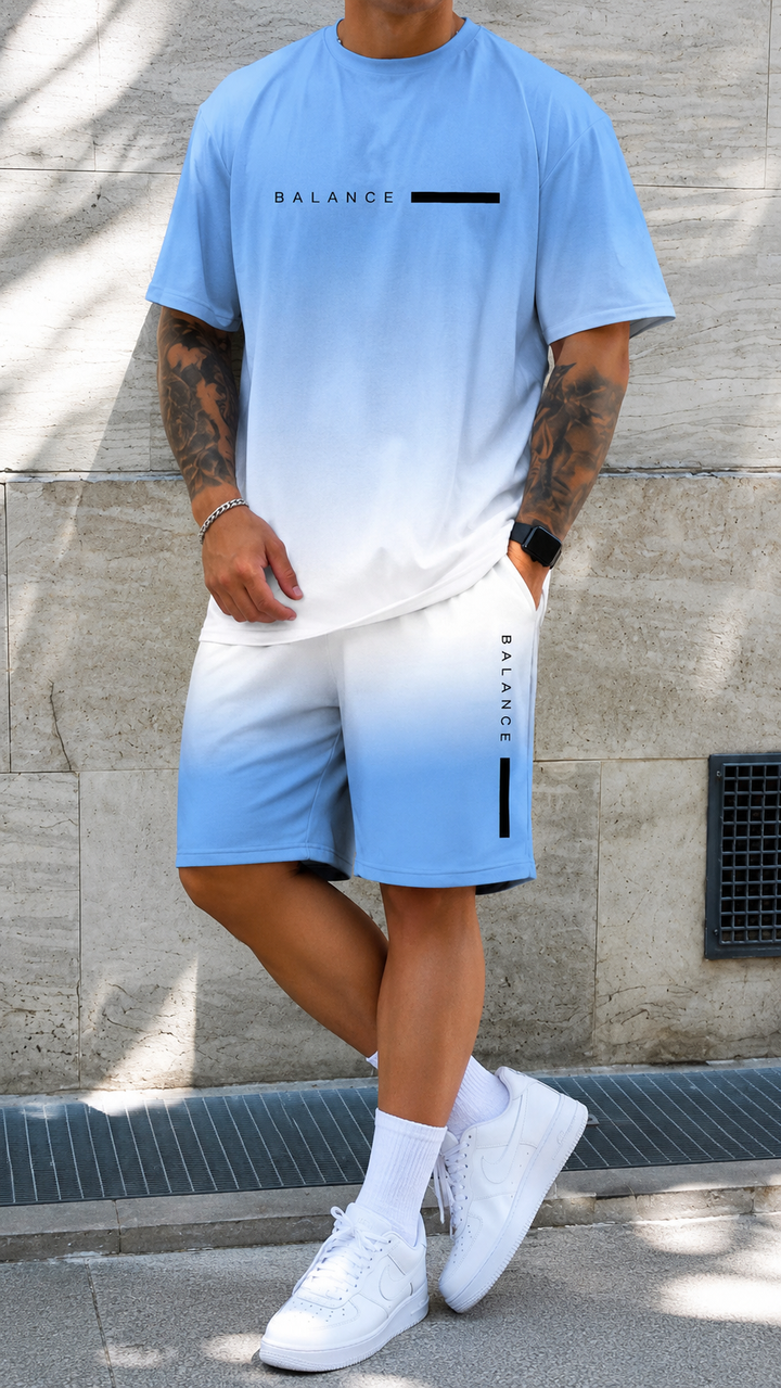 Stylisches Herren Sommeroutfit: T-Shirt & Shorts mit trendigem Farbverlauf. Perfekt für urbane Streetwear.