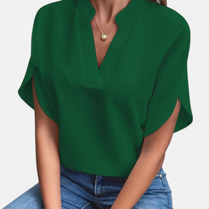 Trendige Damenbluse mit Glockenärmeln & tailliertem Fit. Ideal für stilvolle Frühling/Sommer-Looks.