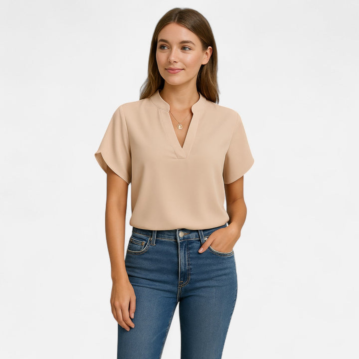 Elegante Damenbluse mit ausgestellten Ärmeln, tailliert geschnitten. Perfekt für Büro & Freizeit.