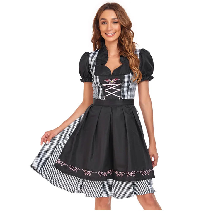 Elegantes schwarzes Damen Dirndlkleid mit traditioneller Schürze, perfekt für Oktoberfest und Volksfeste.
