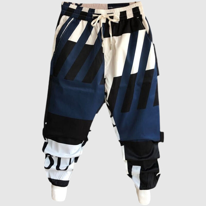 Locker geschnittene Männer Jogginghose mit einzigartigem Graffiti-Design, ein Statement-Piece für Streetwear.