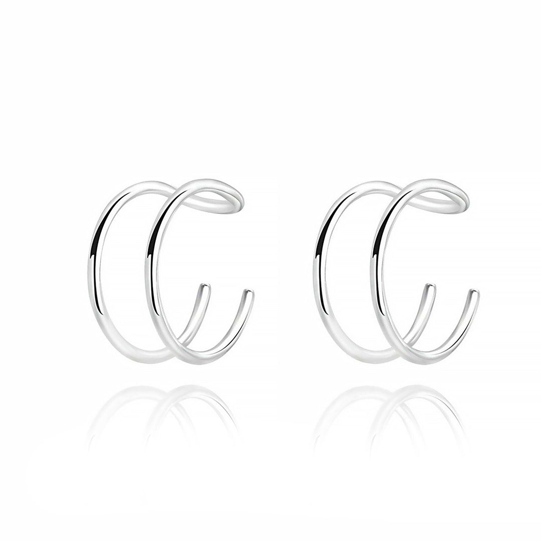 Geometrische U- & X-Design Ohrclips für Damen. Ein zeitloses Accessoire, das jedes Outfit aufwertet.