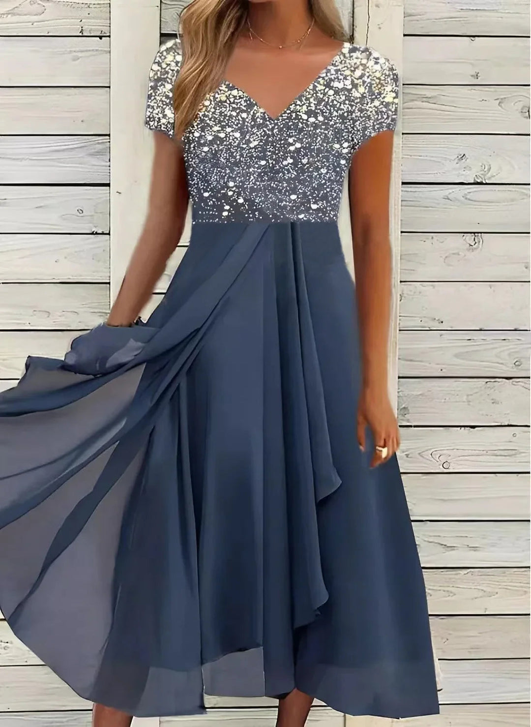 Damen Midikleid für festliche Anlässe. Weibliches Design mit floralem Oberteil und schwingendem Rock für Eleganz.