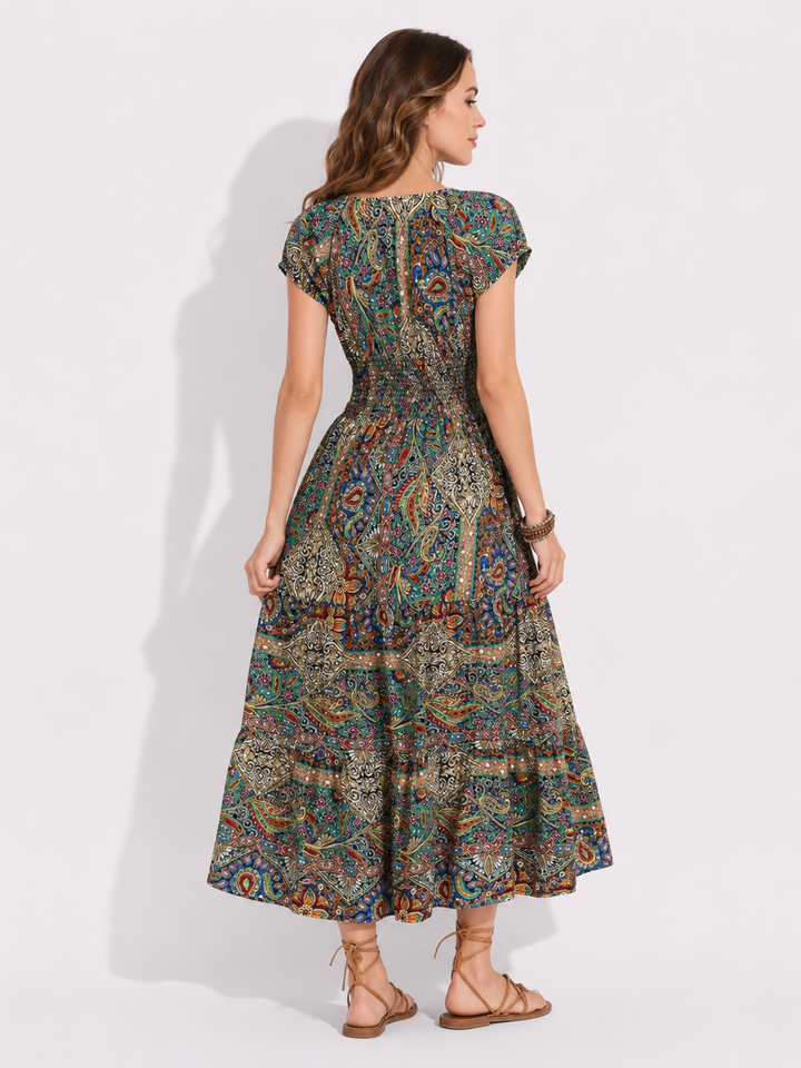 Elegantes Damen Sommerkleid in Midi-Länge mit farbenfrohem Paisley-Print. Ein Muss für Urlaub und entspannte Sommertage.