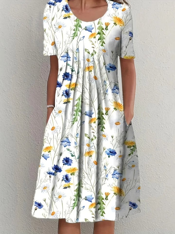 Fließendes Blumen-Sommerkleid für Damen mit Rundhals & kurzen Ärmeln, ideal für elegante Anlässe.