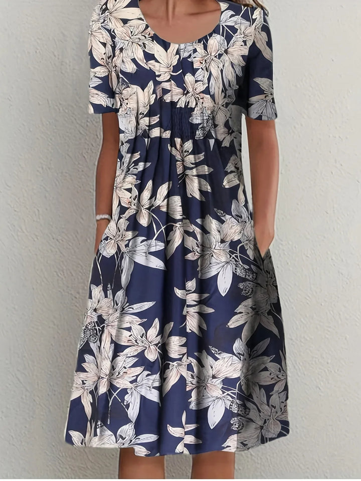 Leichtes Damen Sommerkleid mit floralem Muster, kurzärmliges Design für stilvolle Auftritte.