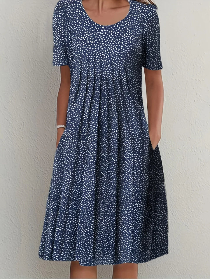 Vielseitiges Damen Blumenkleid, elegant & kurzarm, mit schmeichelhaftem Schnitt für Sommermode.