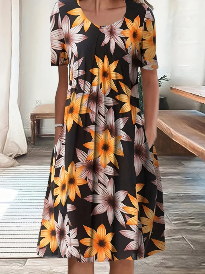Damen Kurzarm-Blumenkleid mit Rundhals, fließend und elegant; das ideale Kleid für Sommeranlässe.