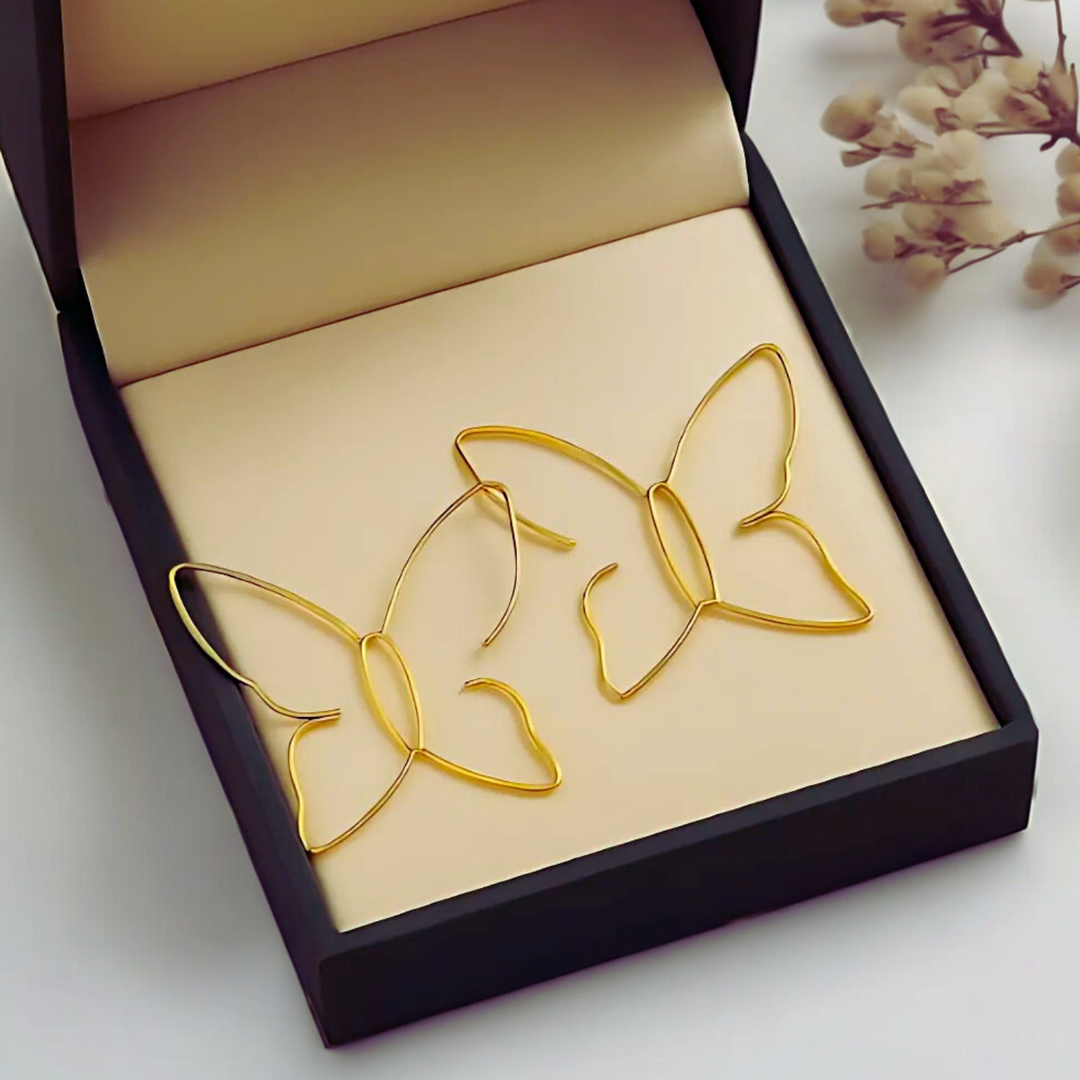 Modische Schmetterling Ohrhänger für Damen, filigraner Schmuck in Gold- und Silberfarben, elegant und zeitlos.