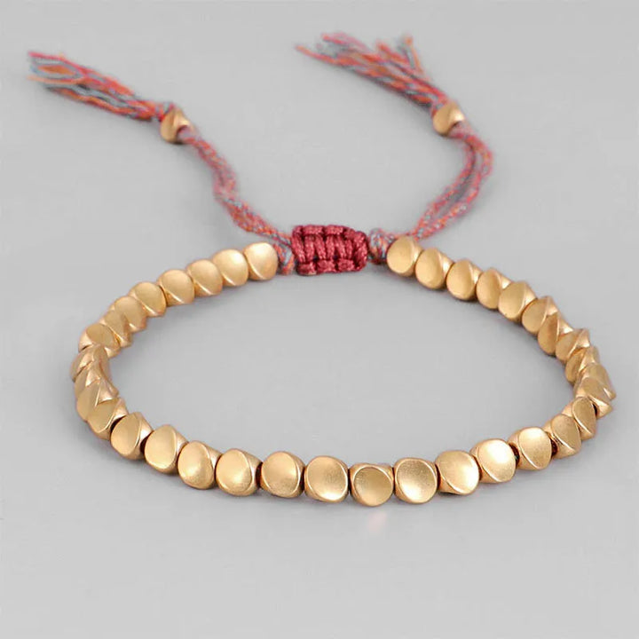 Einzigartiges Spiraldesign Seilarmband mit Kupferdetails, handgefertigt, unisex Accessoire.