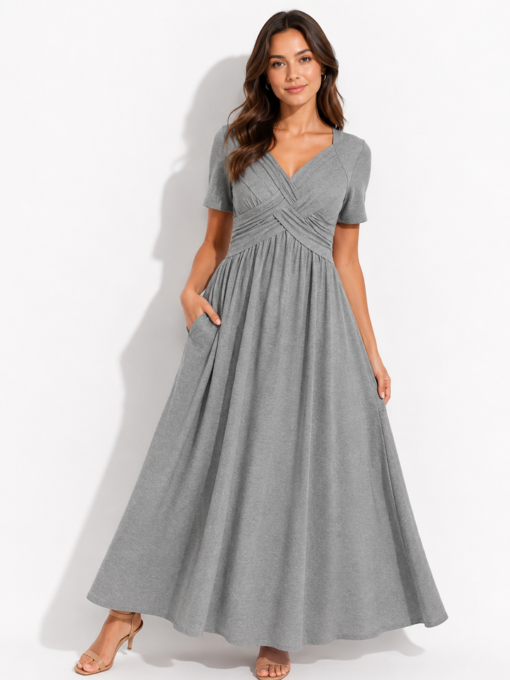 Rückenansicht des eleganten A-Linien Damen Midikleides, komfortabel und stilvoll für jeden Anlass.