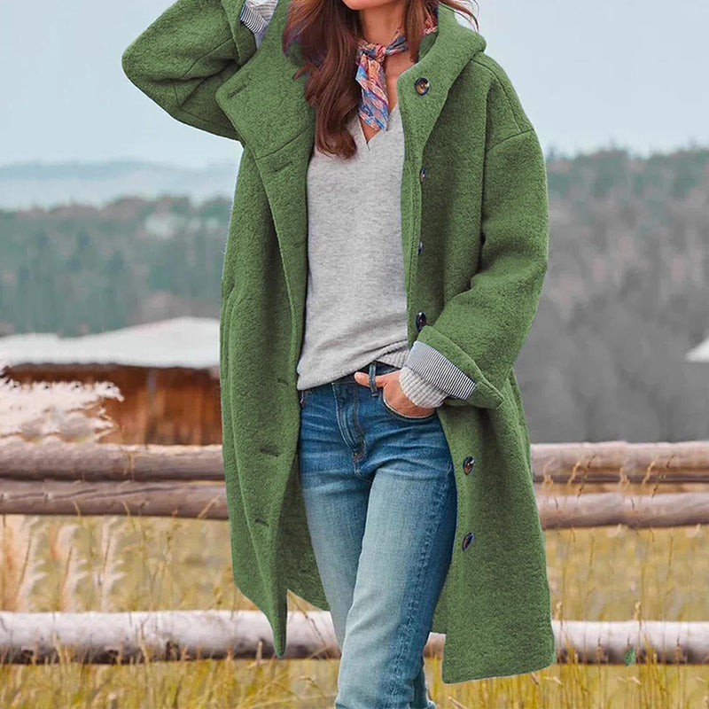 Damen eleganter langer Wintermantel mit Kapuze. Stilvoller warmer Mantel für Damenmode im Herbst & Winter.