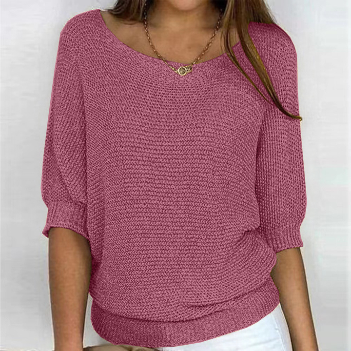 Design-Pullover für Damen mit stilvollem Kreuzmuster. Eleganter und bequemer Langarm-Strick für modernes Auftreten.