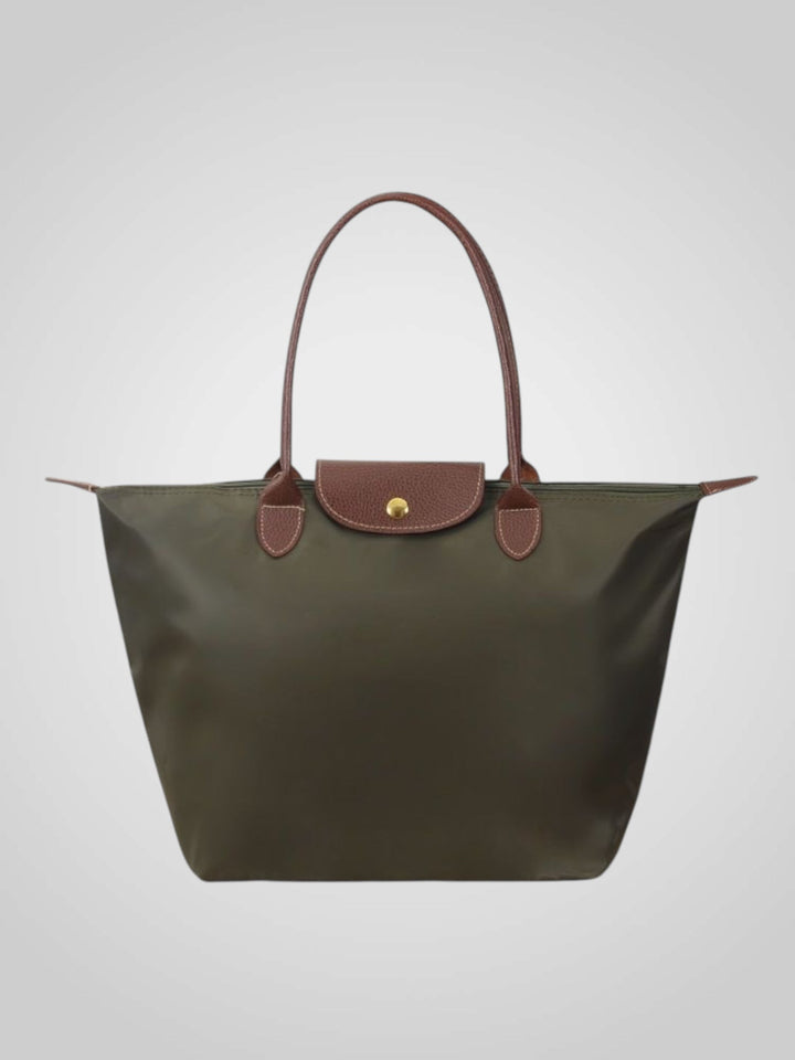 Damen Modeaccessoire: Elegante Handtasche in Pastellfarbe, mit sicherer Schließe & verstellbarem Riemen.