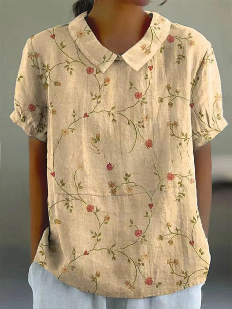 Elegante weiße Damen Sommerbluse mit farbenfrohem Blumenmuster, kurzarm, perfekt für Freizeitlooks.