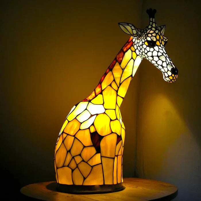 Auffällige AnimalGlow Tischlampe, künstlerisches Buntglas-Tiermotiv als Blickfang.