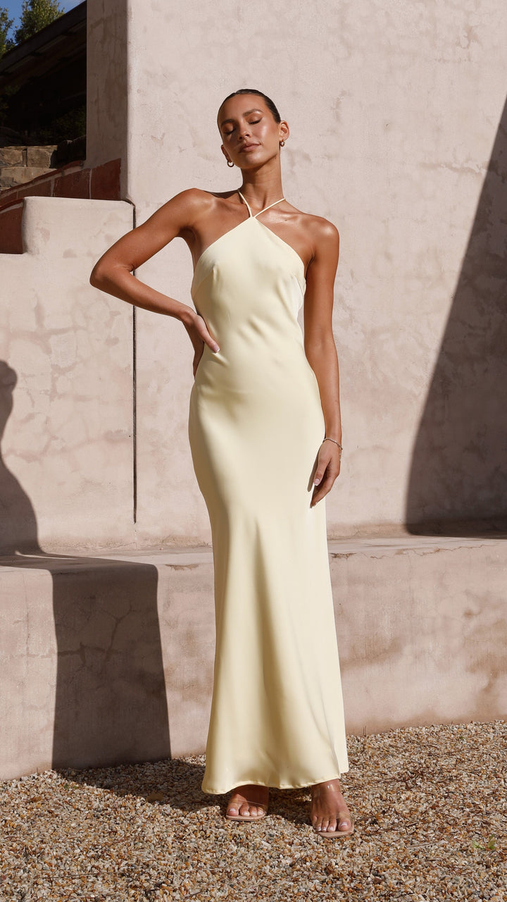Luftiges gelbes Halterneck Sommerkleid für Damen, rückenfreies Maxikleid für elegante Anlässe.