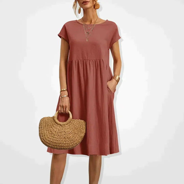 Elodie Damen Sommerkleid aus luftigem Leinen, knielang. Perfektes leichtes Freizeitkleid für warme Sommertage.