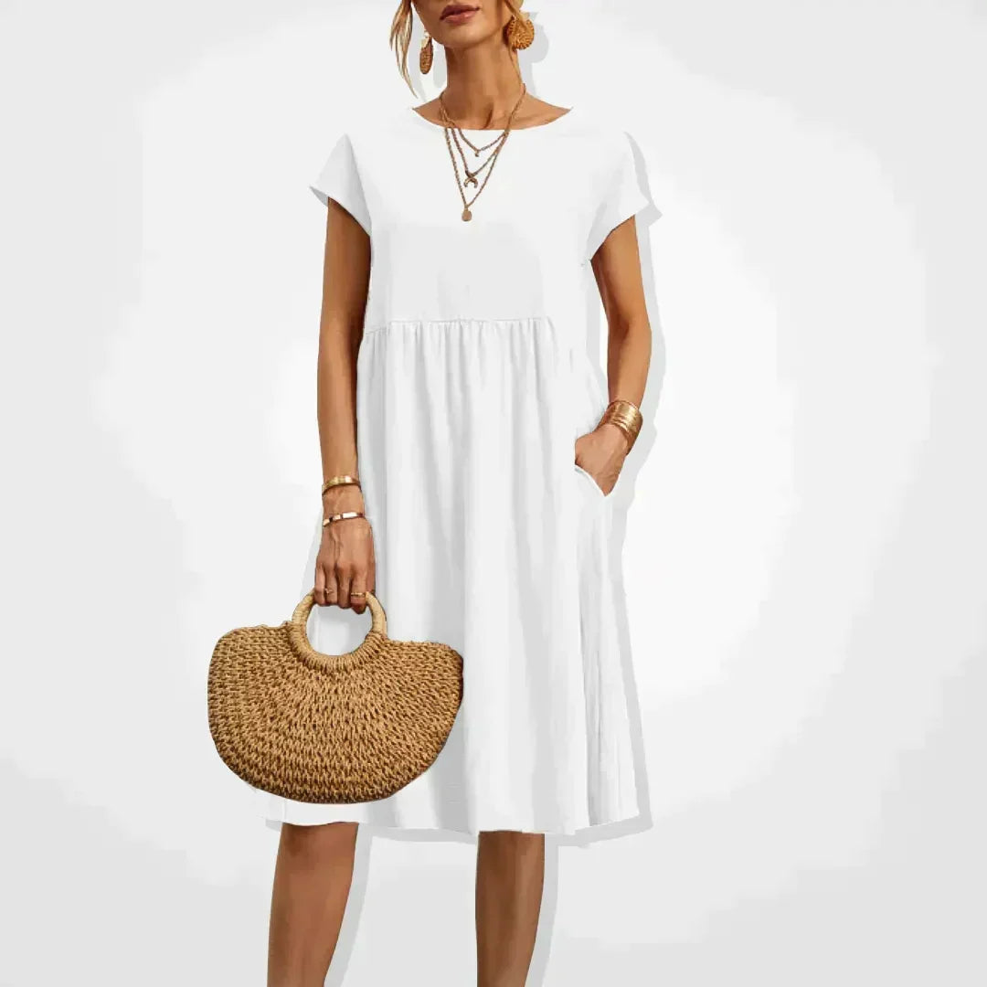 Elodie Damen Sommerkleid aus Leinen mit praktischen Taschen. Knielanges, bequemes Freizeitkleid für warme Sommertage.
