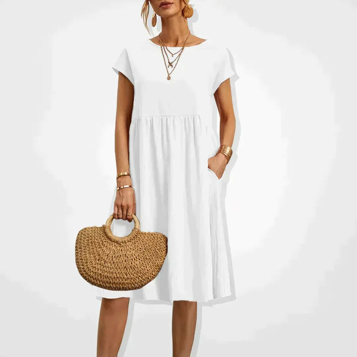 Elodie Damen Sommerkleid aus Leinen mit praktischen Taschen. Knielanges, bequemes Freizeitkleid für warme Sommertage.