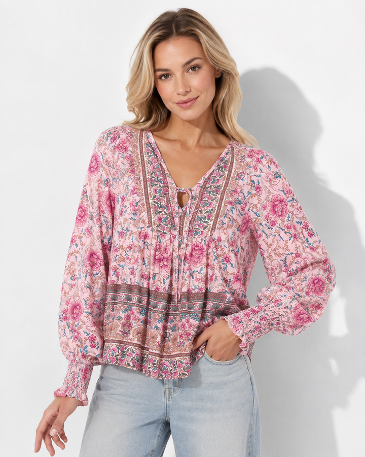Damen bedrucktes Langarmshirt mit V-Ausschnitt & elegantem Krawattendetail. Buntes Oberteil für Freizeit & Büro.