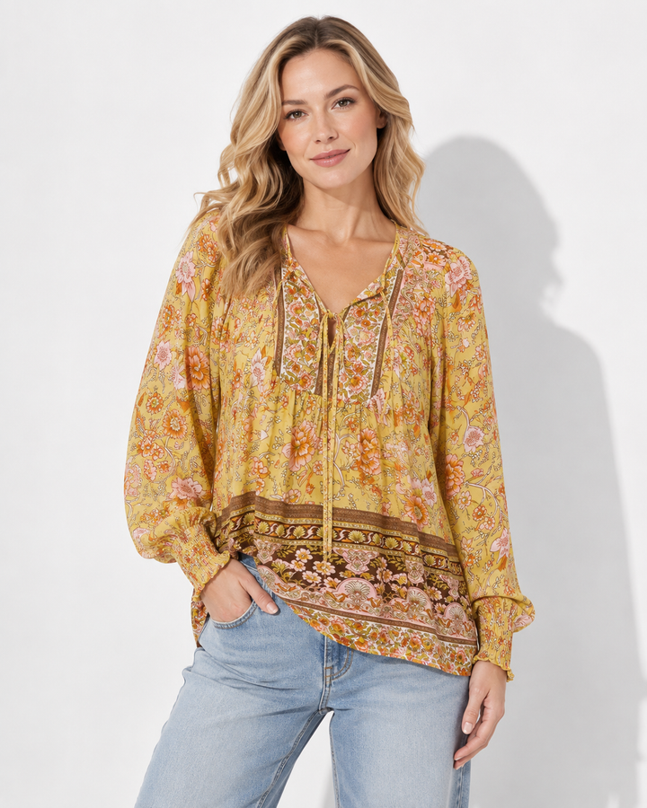 Frühlingshaftes Damen Langarmshirt, bedruckt, mit V-Ausschnitt. Elegante Bluse mit Krawattendetail für Büro.