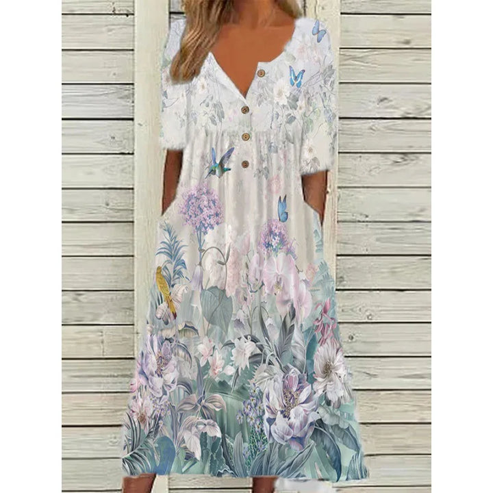 Stylisches Sommerkleid für Damen: florales Muster, V-Ausschnitt, kurze Ärmel, A-Linie & praktische Taschen.