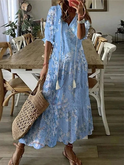 Elegantes fließendes Damen Boho Midikleid mit V-Ausschnitt, perfekt als Sommer- oder Freizeitkleid.