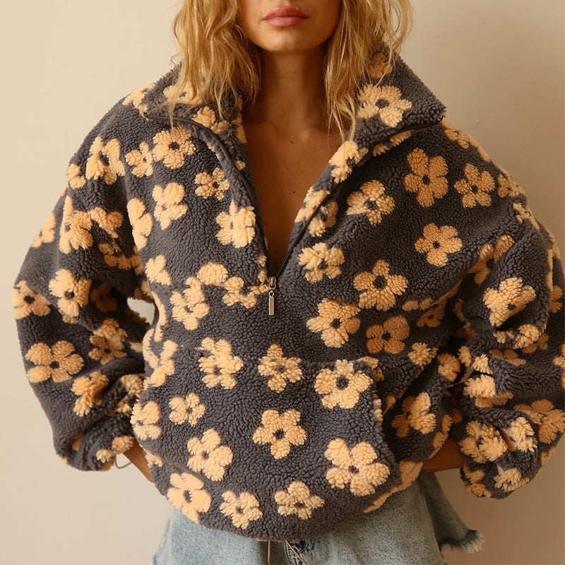 Damen Pullover mit Blumenmuster für den Herbst. Gemütlicher, stilvoller Langarm-Sweatshirt für Frauen.