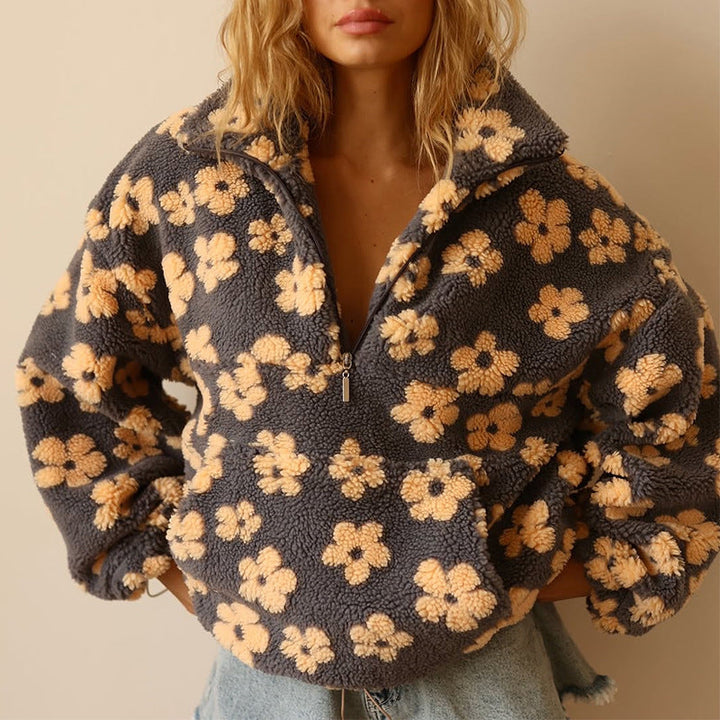 Damen Pullover mit Blumenmuster für den Herbst. Gemütlicher, stilvoller Langarm-Sweatshirt für Frauen.