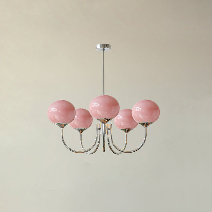 Roségoldener Kronleuchter, 10-flammig, mit transparenten Glas-Schirmen; Blickfang in hohen Räumen.