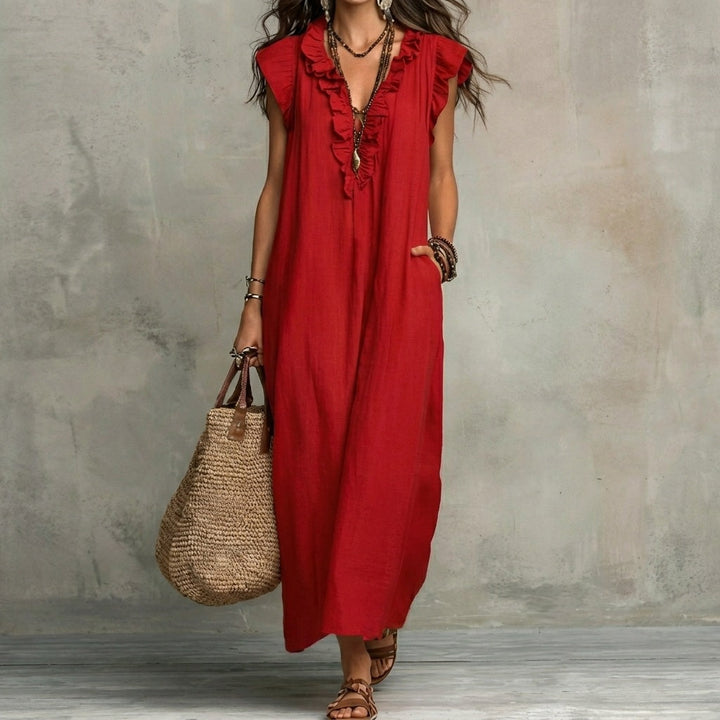 Luftiges Damen Maxikleid, perfekt für den Sommerurlaub. Mit V-Ausschnitt und eleganten Rüschen designt.