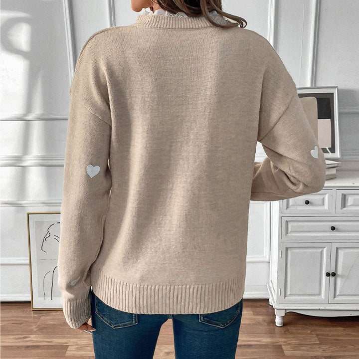 Gemusterter Damen Rundhalspullover mit Herz-Design. Warmer Freizeitpullover aus Strick für Herbst und Winter.