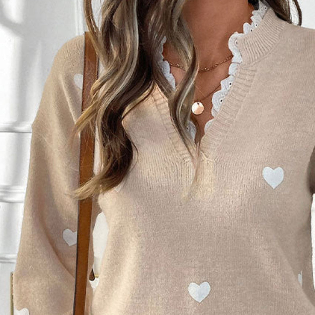 Kuscheliger Damen Langarmpullover mit Herzmuster. Perfekt für den Valentinstag oder gemütliche Alltagsmomente.