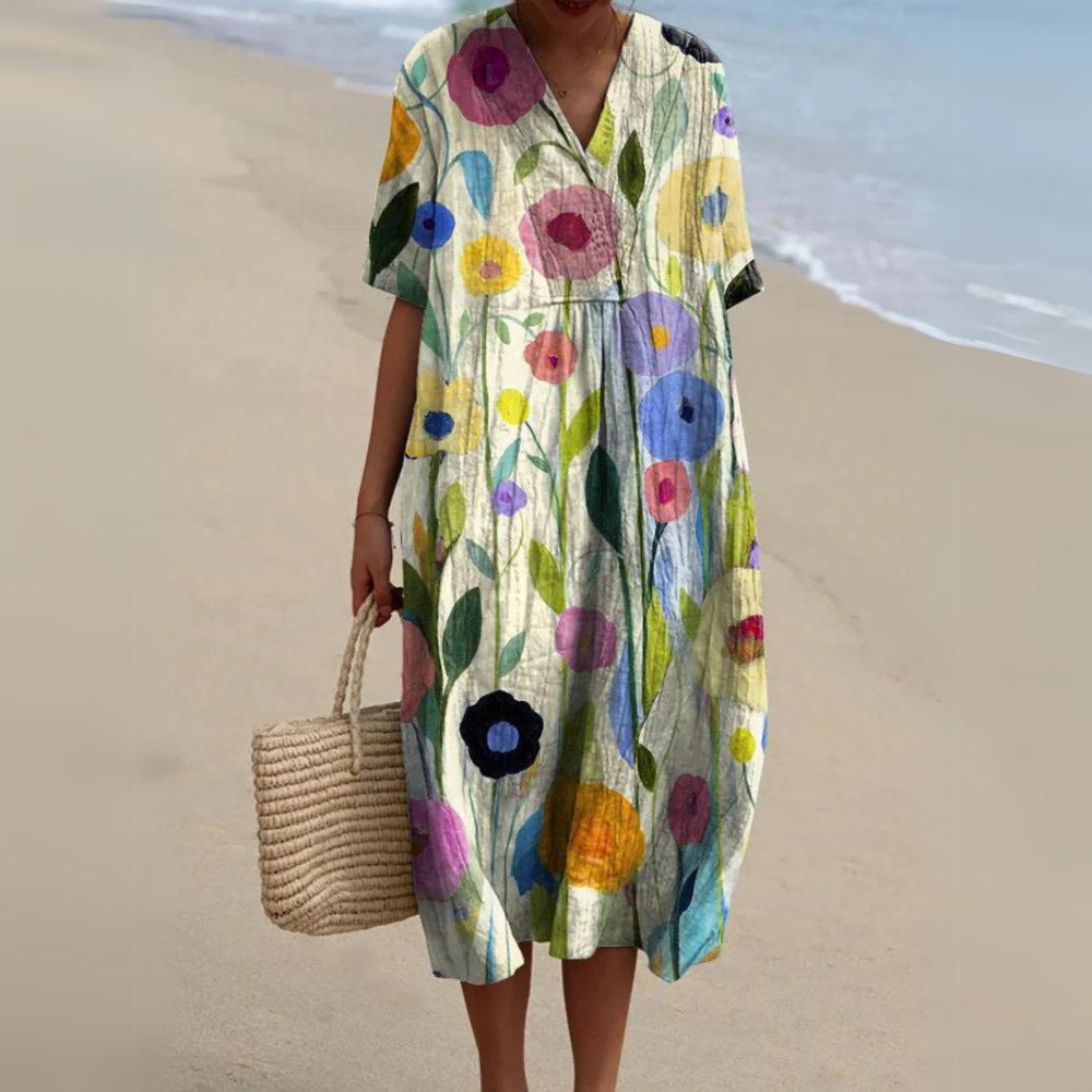 Stilvolles Damen Boho Strandkleid mit Blumen, Midi-Länge & V-Ausschnitt. Luftiges Freizeitkleid für den Sommer.